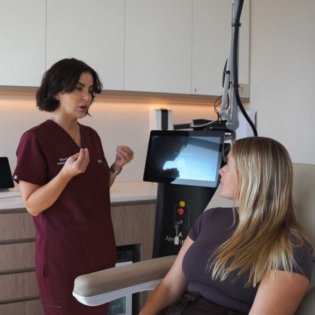 Chelsea Hyett explaining the Alma Hybrid laser treatment to a patient during a personalised consultation at Sisä Skincare in Freshwater on Sydney's Northern Beaches.